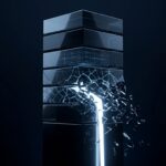 A stack of dark glass blocks with one fracturing and leaking white light